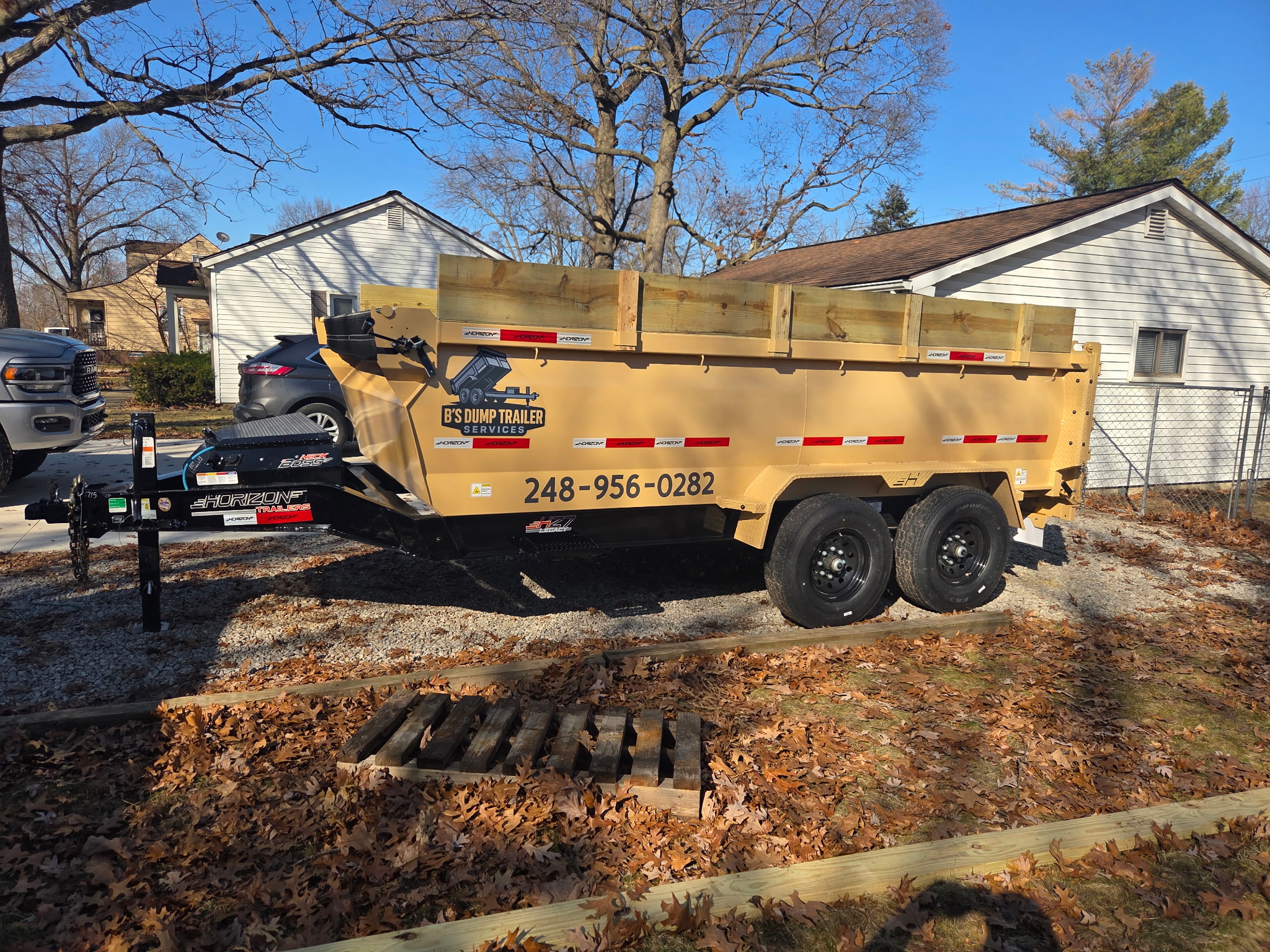 15-yard extra capacity dump trailer with wood extensions for large projects in Michigan