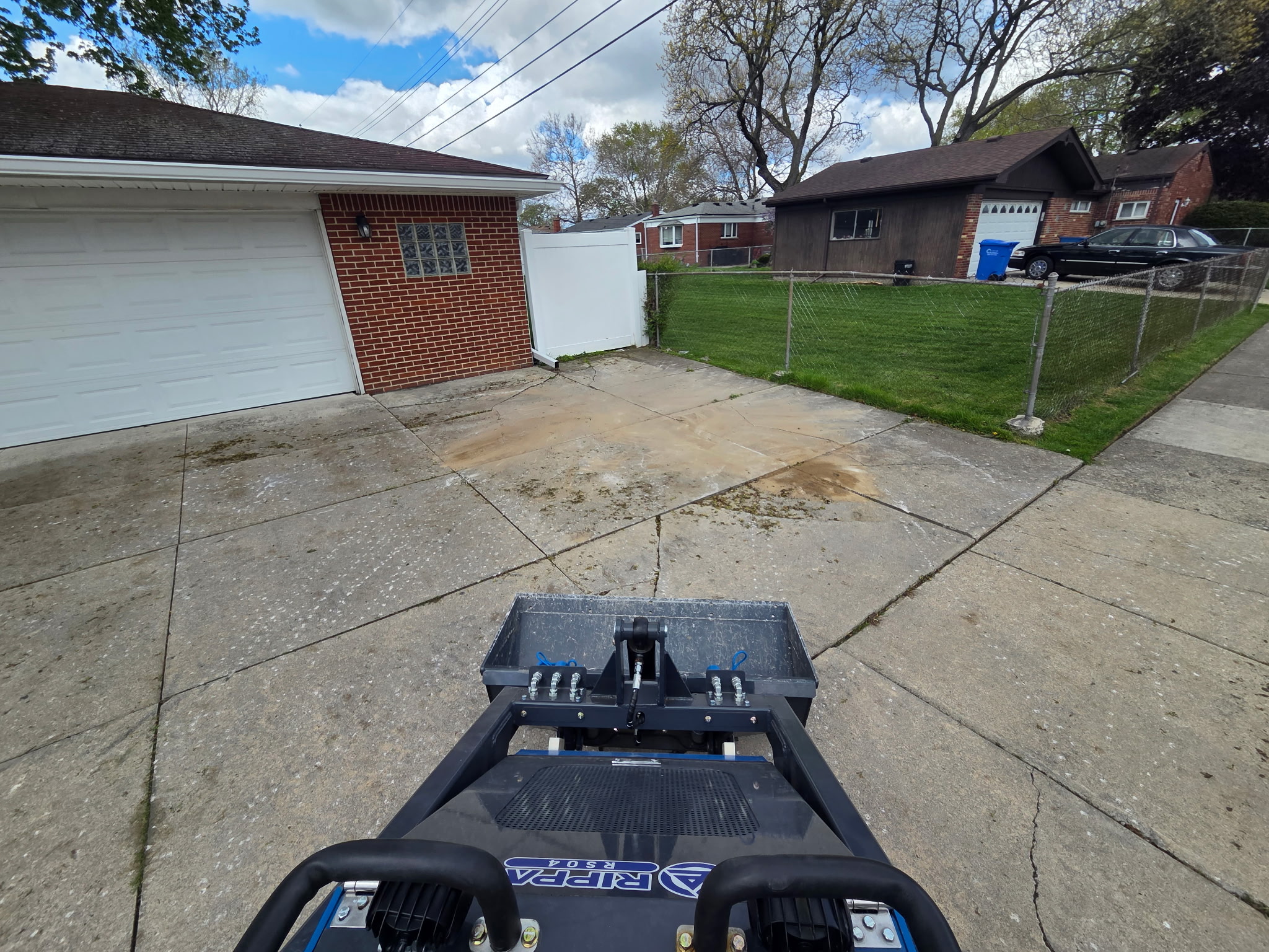 Clean driveway after concrete debris removal in Michigan
